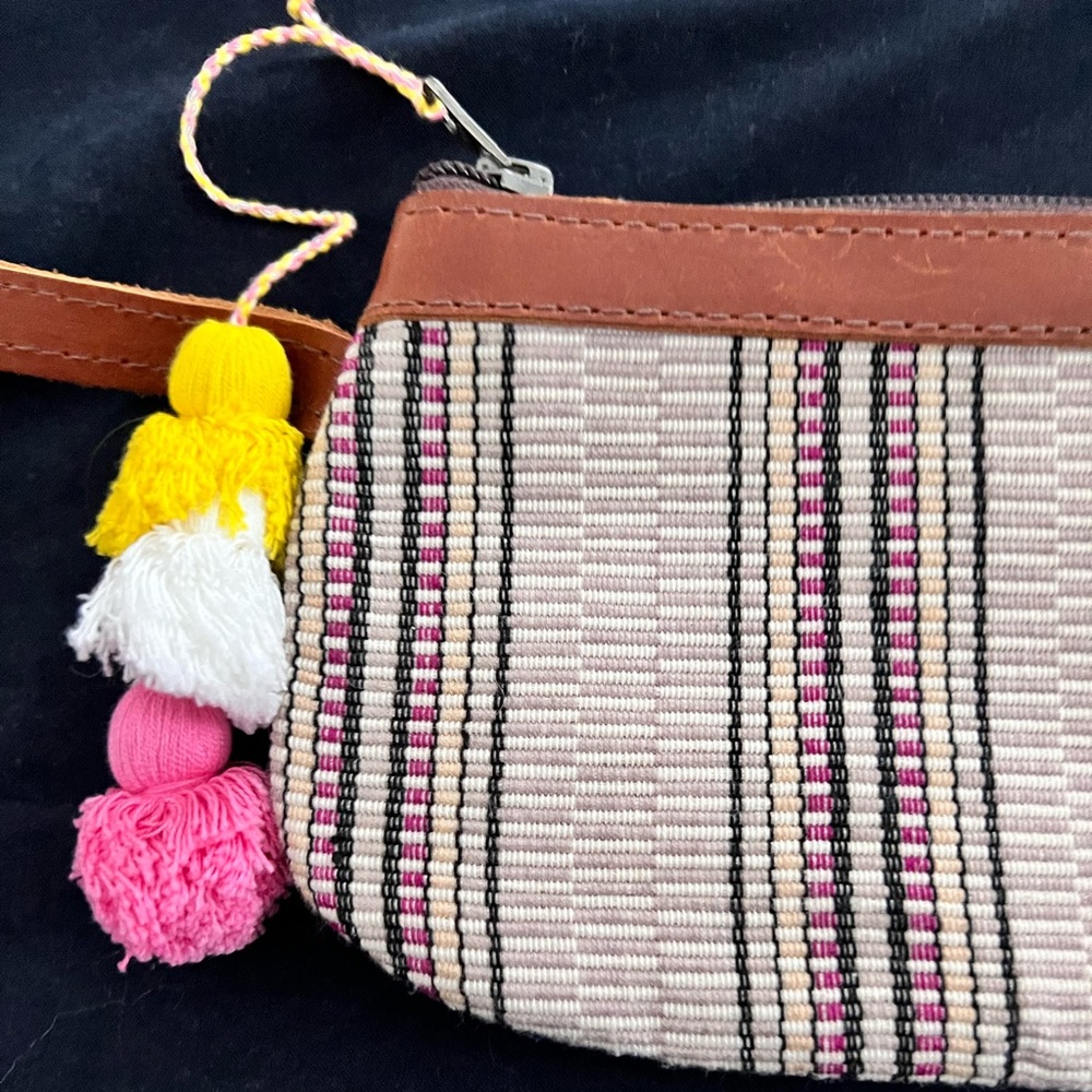 Nena & Co clutch Pom wristlet.